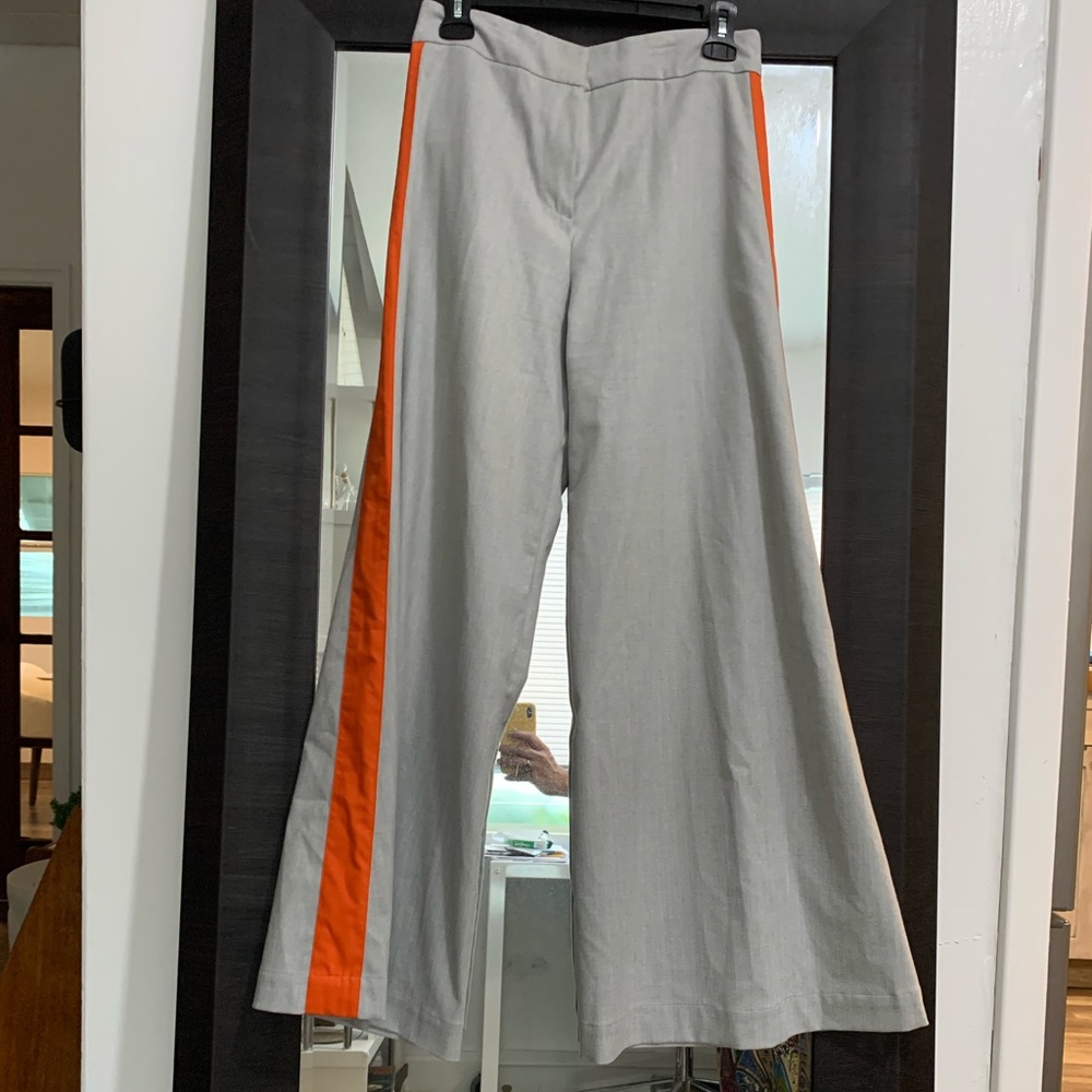 Unique gray flare pants with orange stripe on the sides.